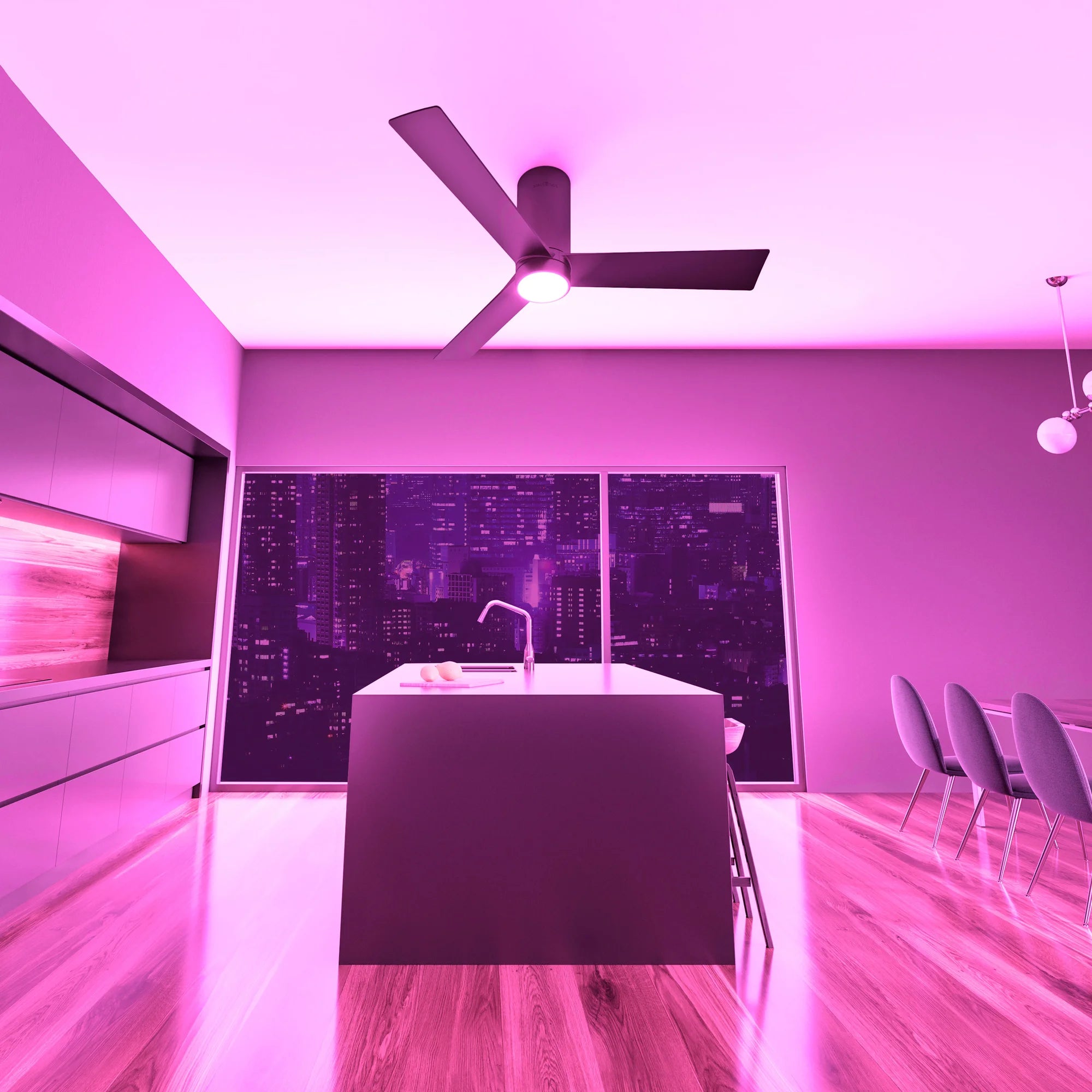 Modern kitchen with city skyline view at night, illuminated in purple light from the Nouvo³ Smart Flush Mount Ceiling Fan's RGB mode